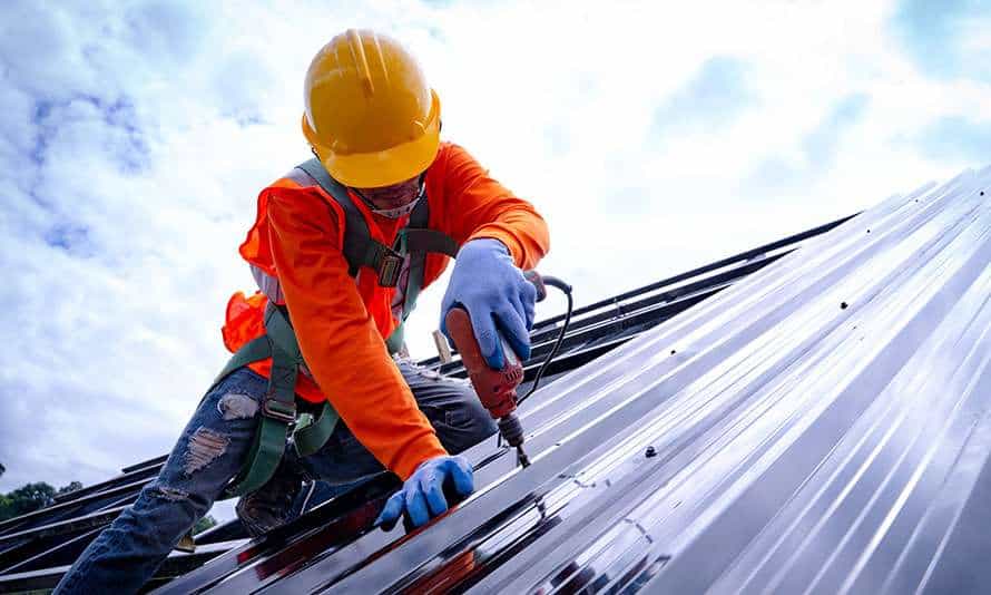 Roofer working on a building