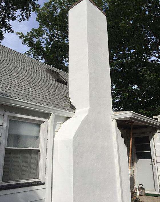 Stucco Chimney Replacement - After - First Rate Roofing and Chimney