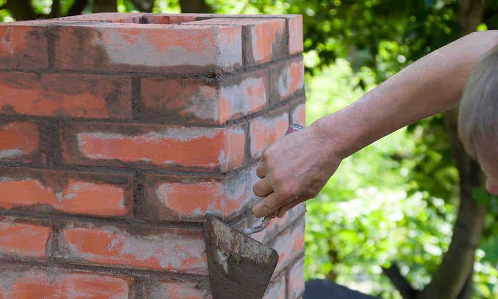 Chimney Expert Repairing a Chimney