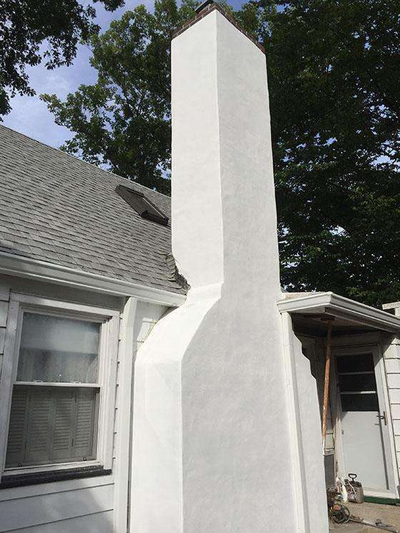 Stucco Chimney Replacement - After - First Rate Roofing and Chimney