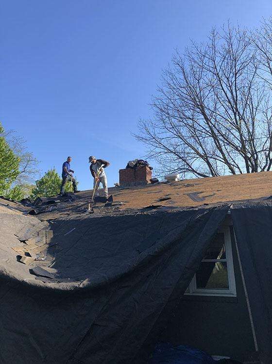 First Rate Roofing and Chimney - Team on a Roof Demolishing for Roof Replacement